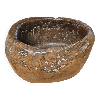 A substantial hand-hewn wooden bowl carved from a single burl section