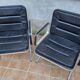 Pair of vintage leather and aluminum armchairs, restored