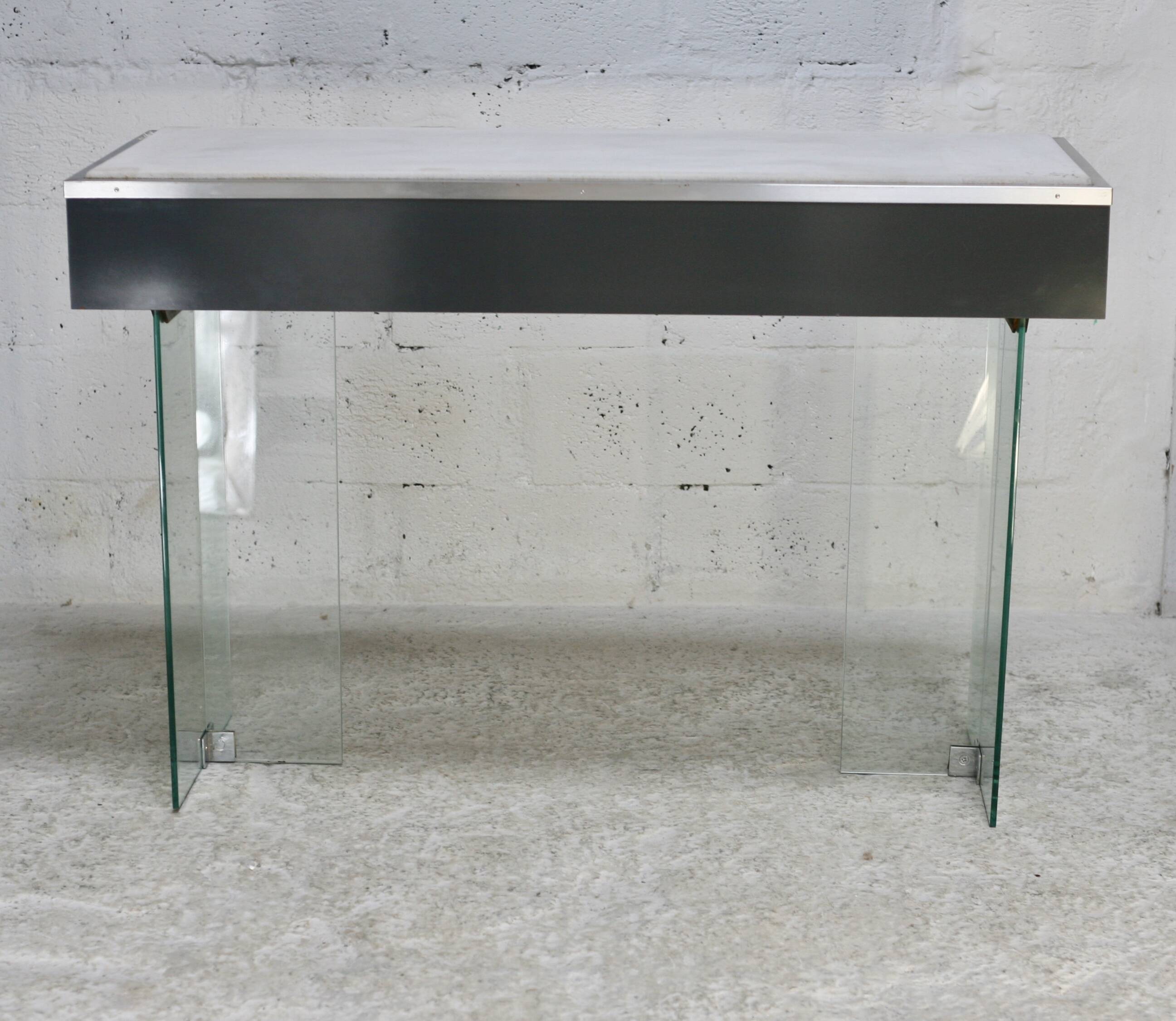 Modernist console, 1960s, glass base, wooden and fabric top.