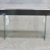 Modernist console, 1960s, glass base, wooden and fabric top.