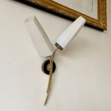 Black and gold metal wall and white opalines sconce