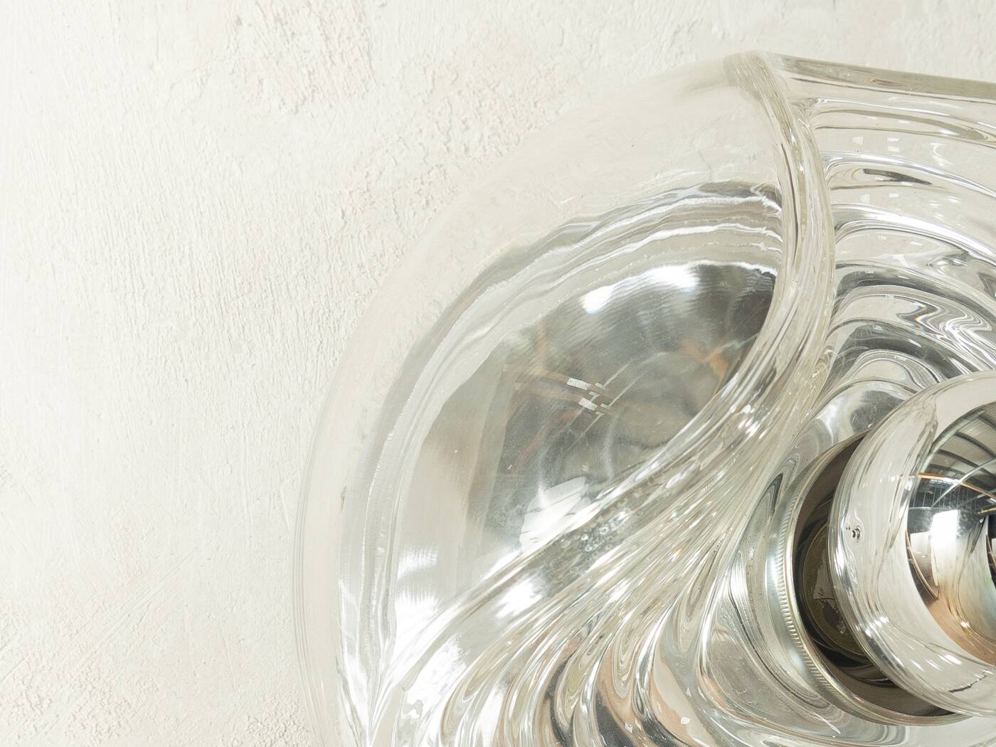 Sculptural wave wall lamp made of structured solid glass by peill & putzler