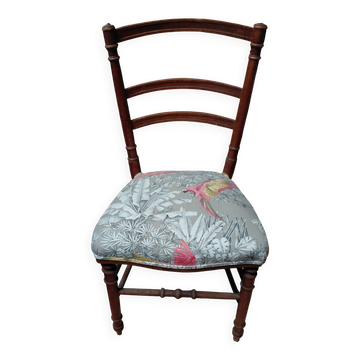 Antique chair with parrot fabric