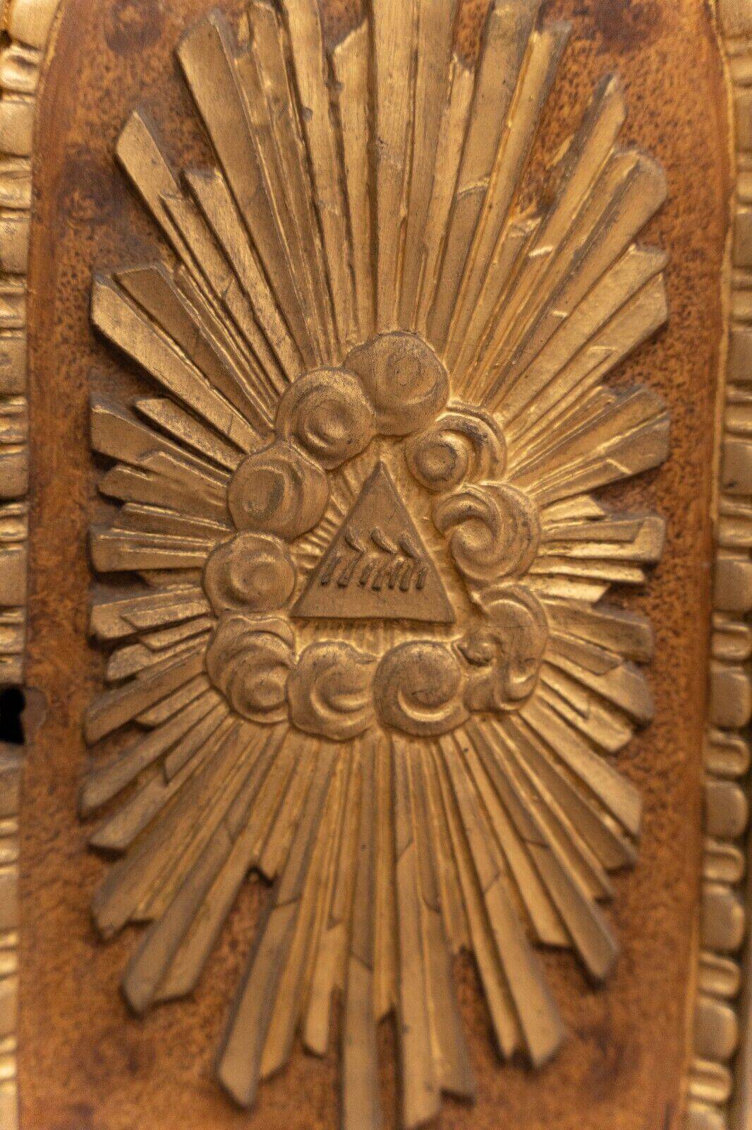 18th century tabernacle decorated with 2 columns and a sun on the facade