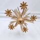 Vintage wrought iron chandelier decorated with golden and beige reeds