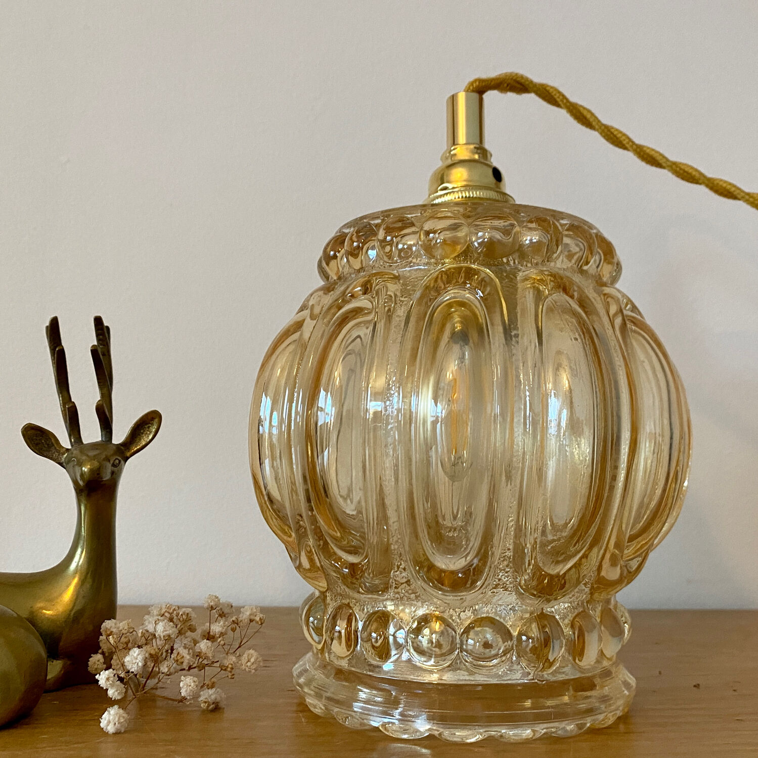 Baladeuse tulipe vintage en verre ambré