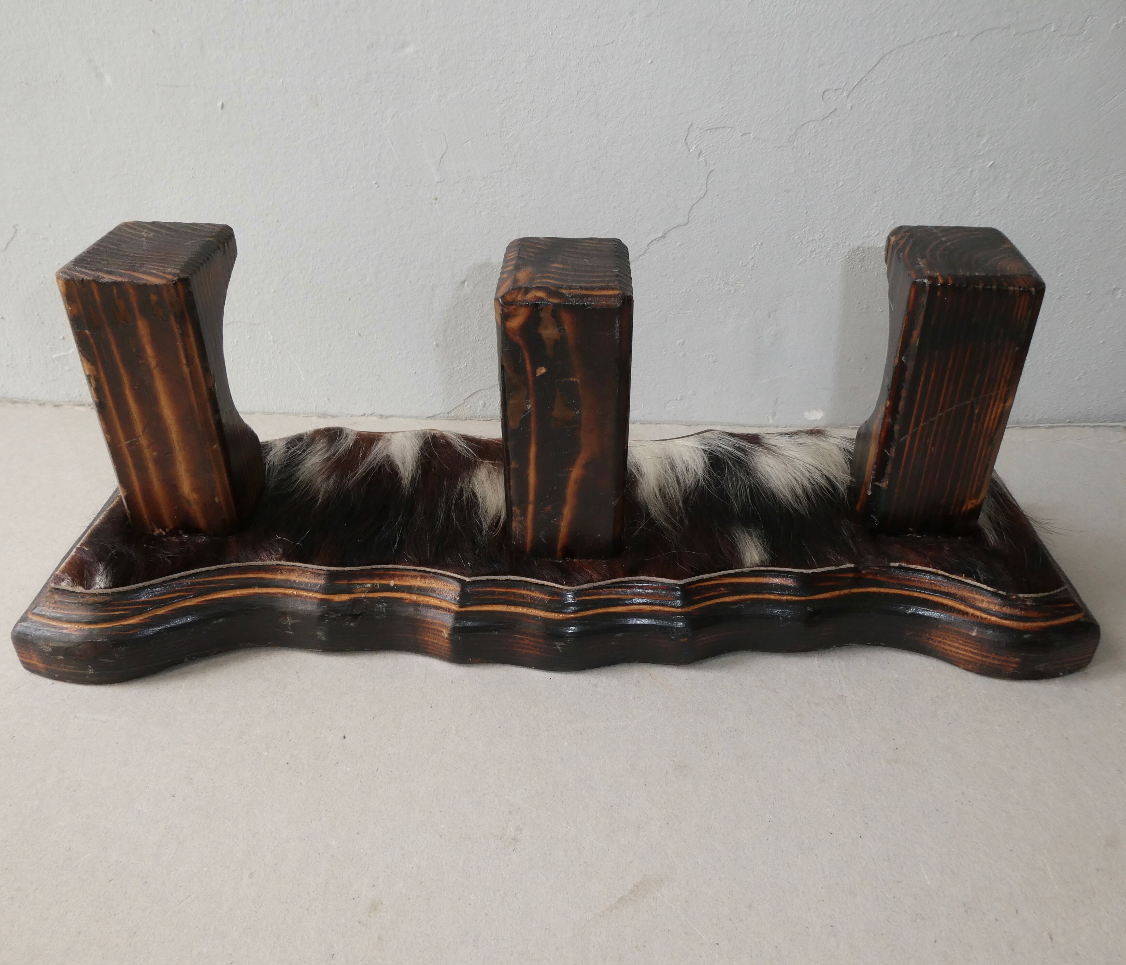 Wall hanger in burnt pine and cow skin
