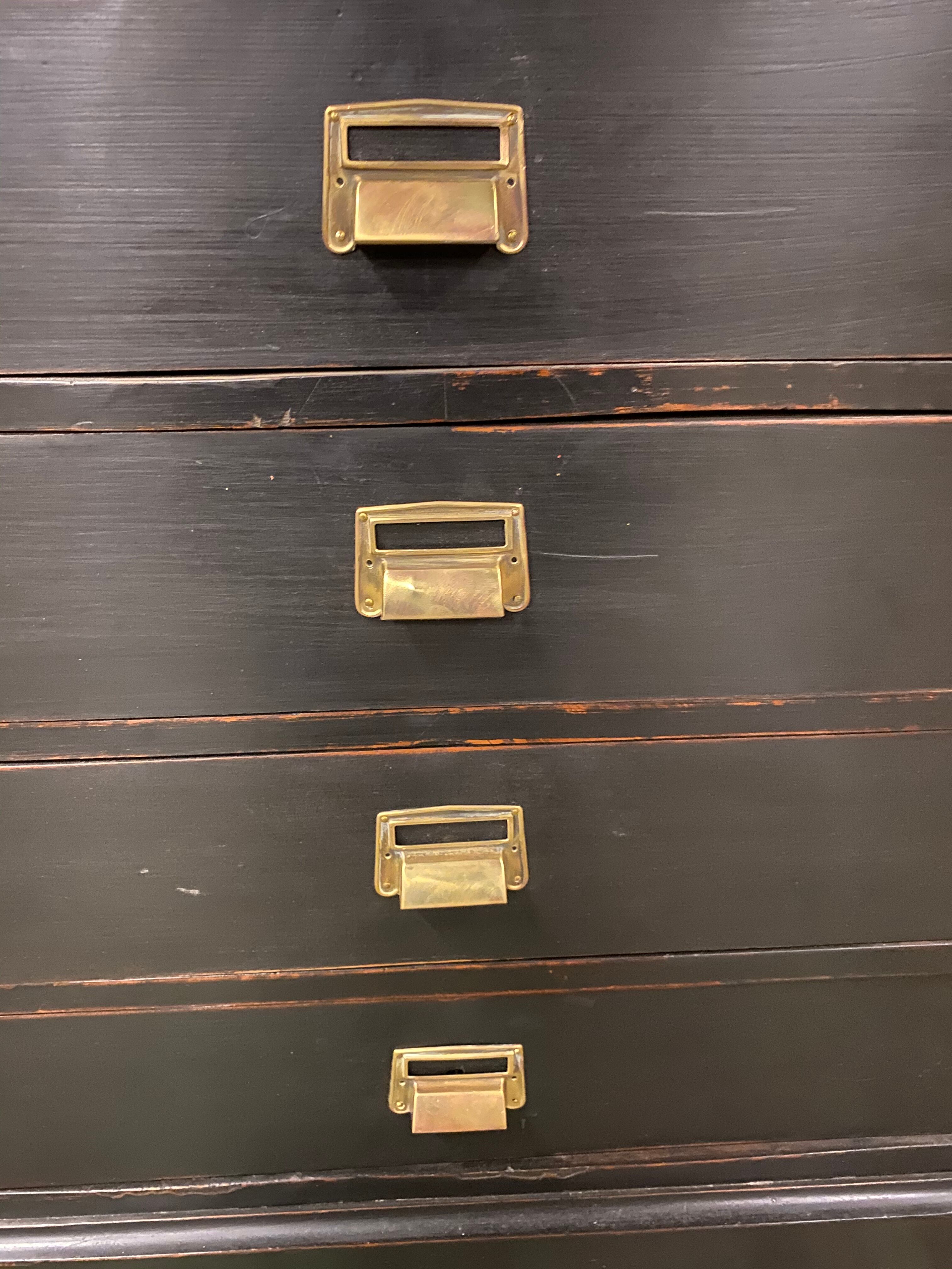 Old black patinated chest of drwers