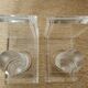 Pair of column bookends in plexiglass and gold metal, 1980s design.
