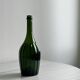 Translucent green glass bottle, classic design.
