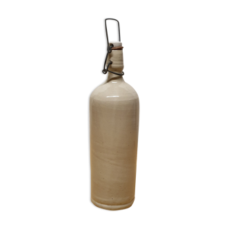 Bottle in old enamelled sandstone