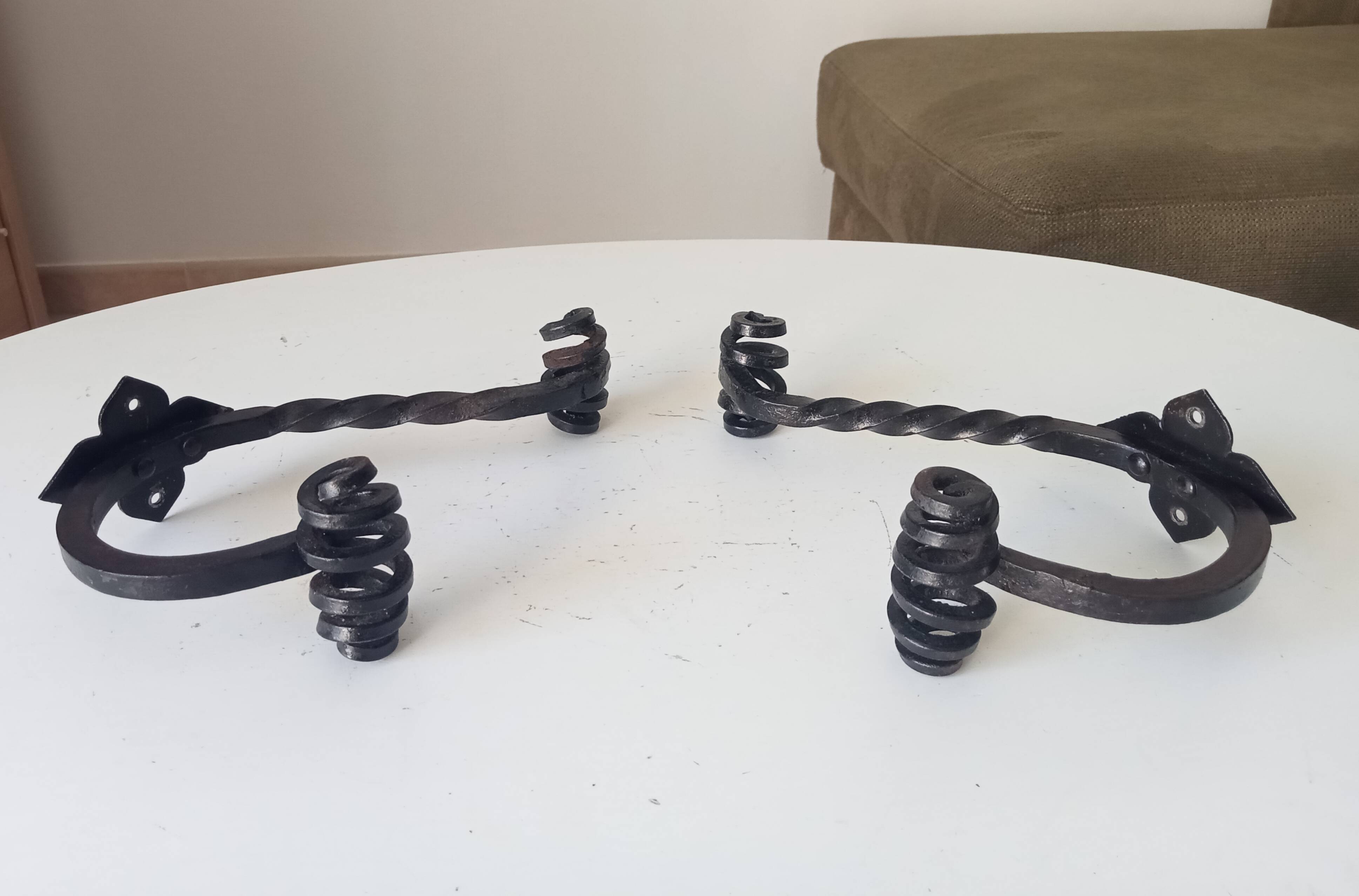 Brutalist wall coat rack in wrought iron.