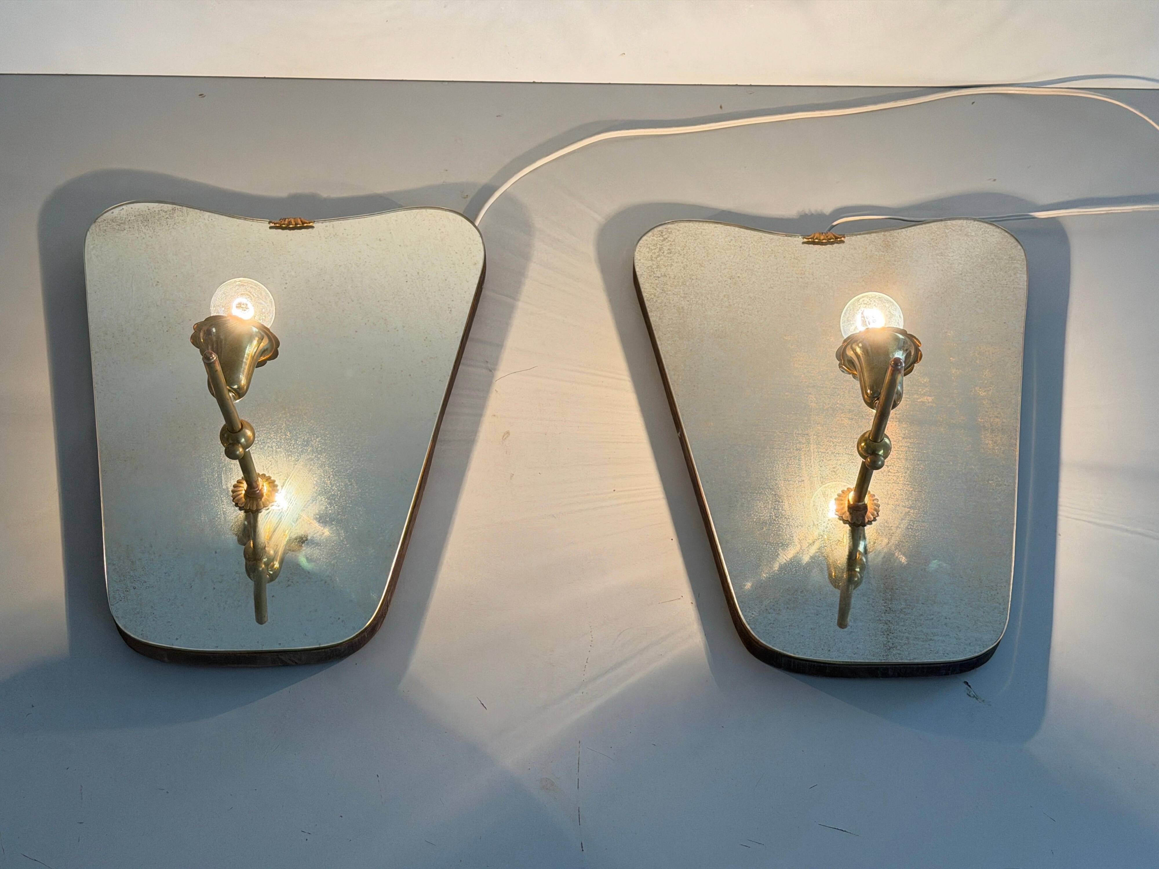 Pair of brass wall lights with mirrors, mid-20th century, Italy, 1960.