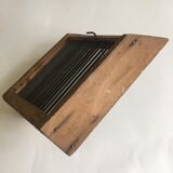 Old comb with berries (blueberries ..) in wood and metal