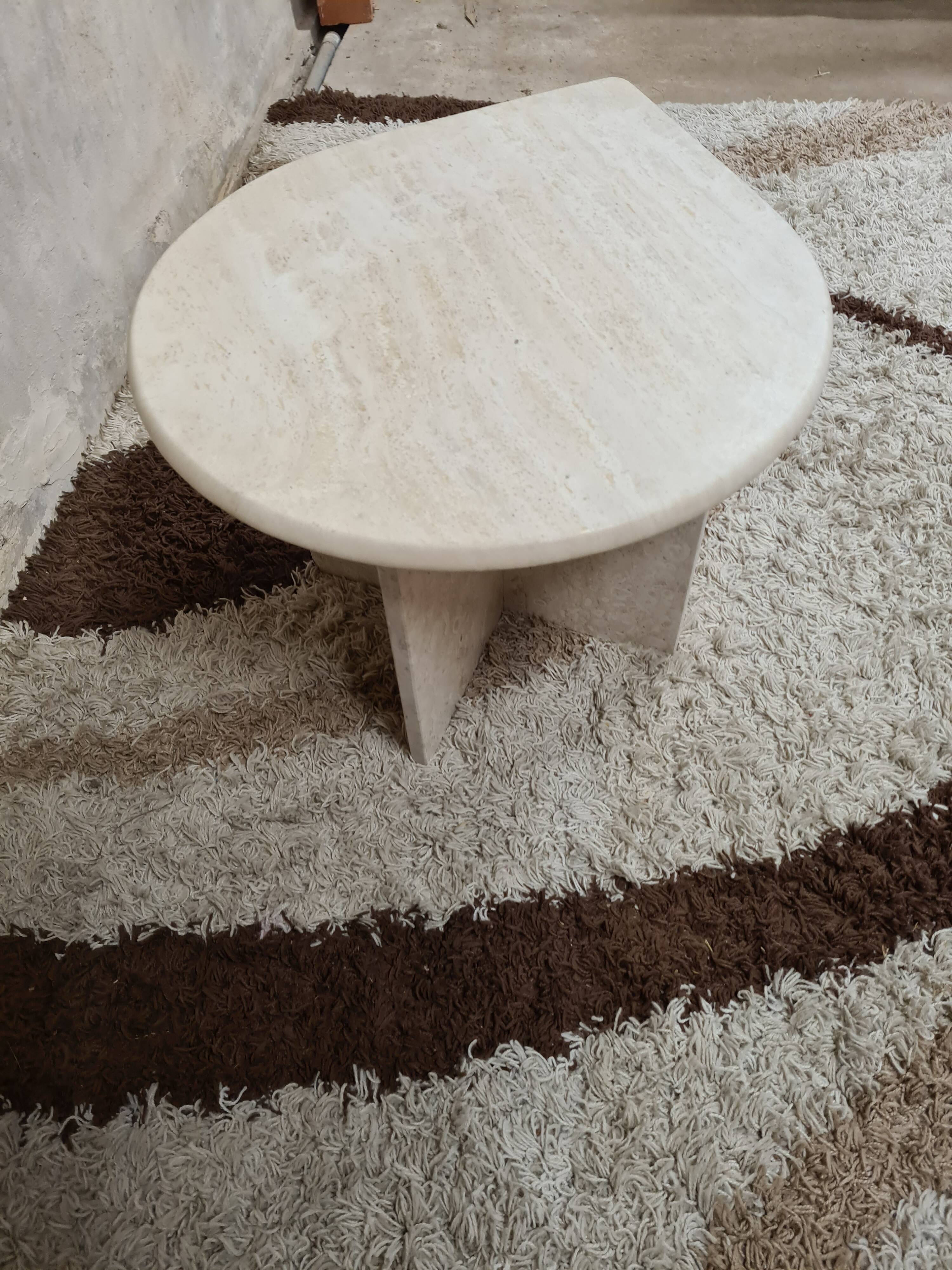 Travertine drop-shaped coffee table