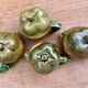 4 slip pots depicting a pepper, early 20th century