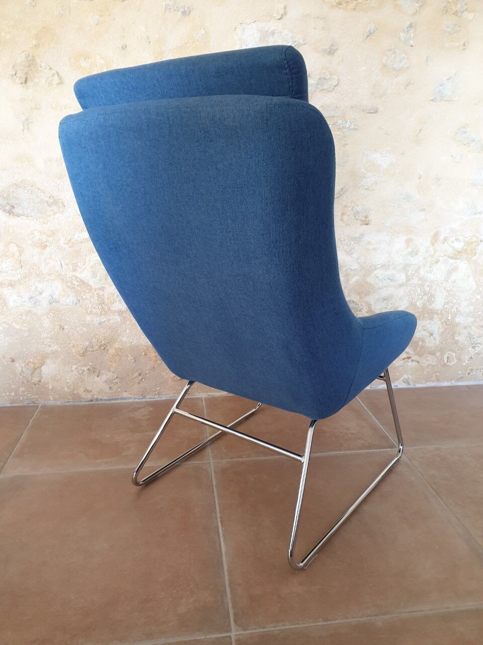 Armchair and its footrest