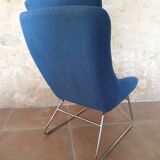 Armchair and its footrest