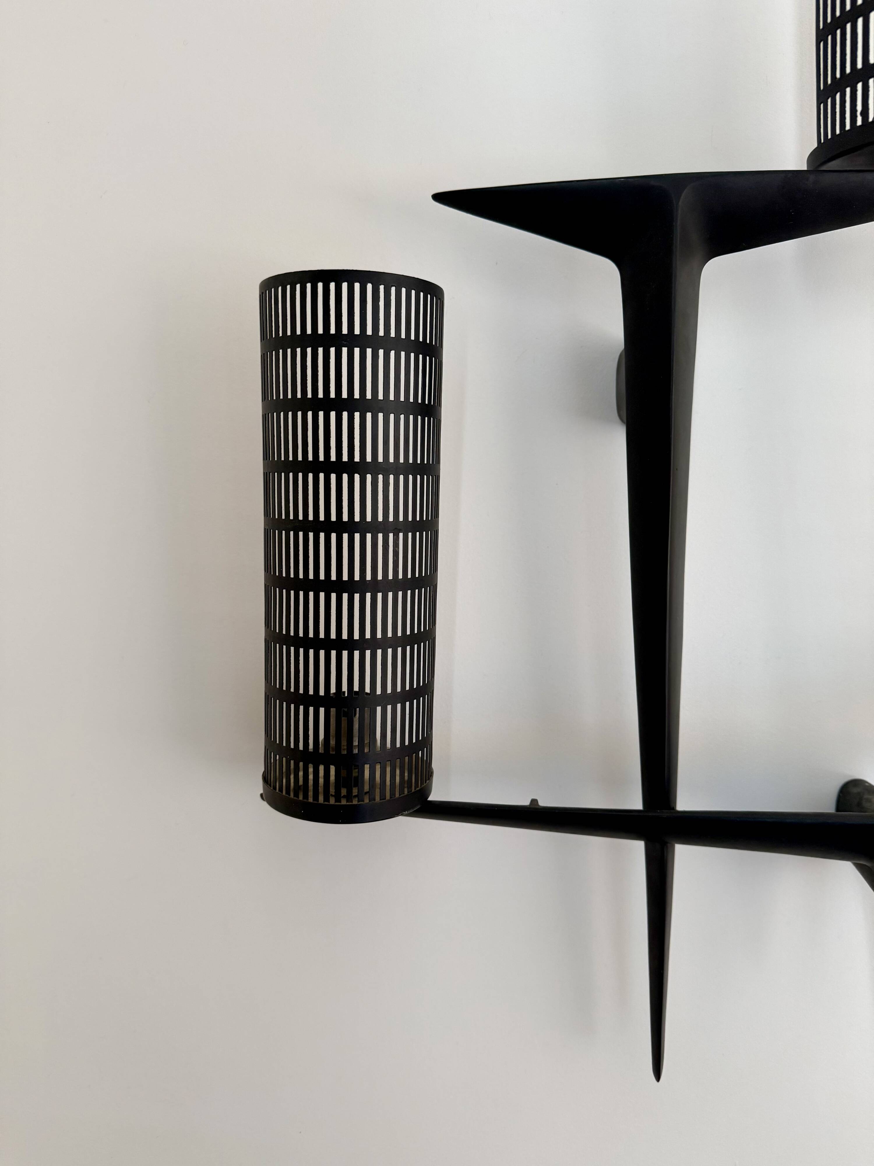 Pair of sculpted lacquered bronze wall lights, Arlus
