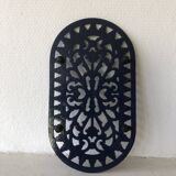 Cast iron trivet made of enameled cast iron