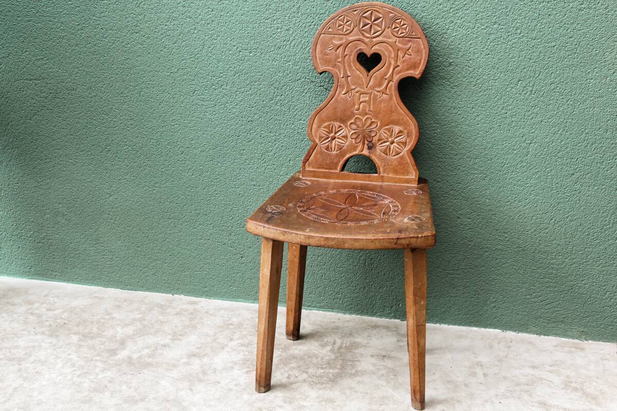 Old Swiss escabelle chair in carved wood