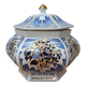 Decorative pot jar with a lid featuring a blue floral pattern and gilding.