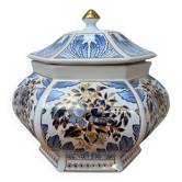 Decorative pot jar with a lid featuring a blue floral pattern and gilding.