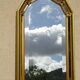 Vertical mirror, gold frame with beading.