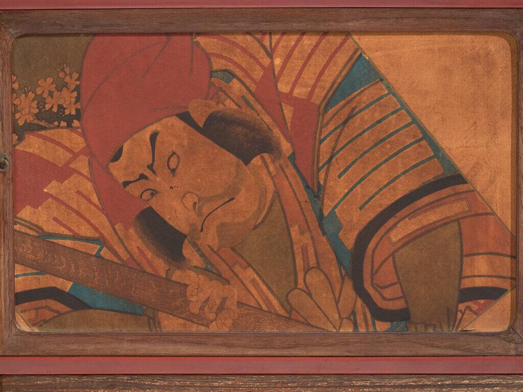 Small Japanese cabinet with sliding doors, Kabuki decoration, made of paulownia wood, early Showa period, circa 1926–1970.