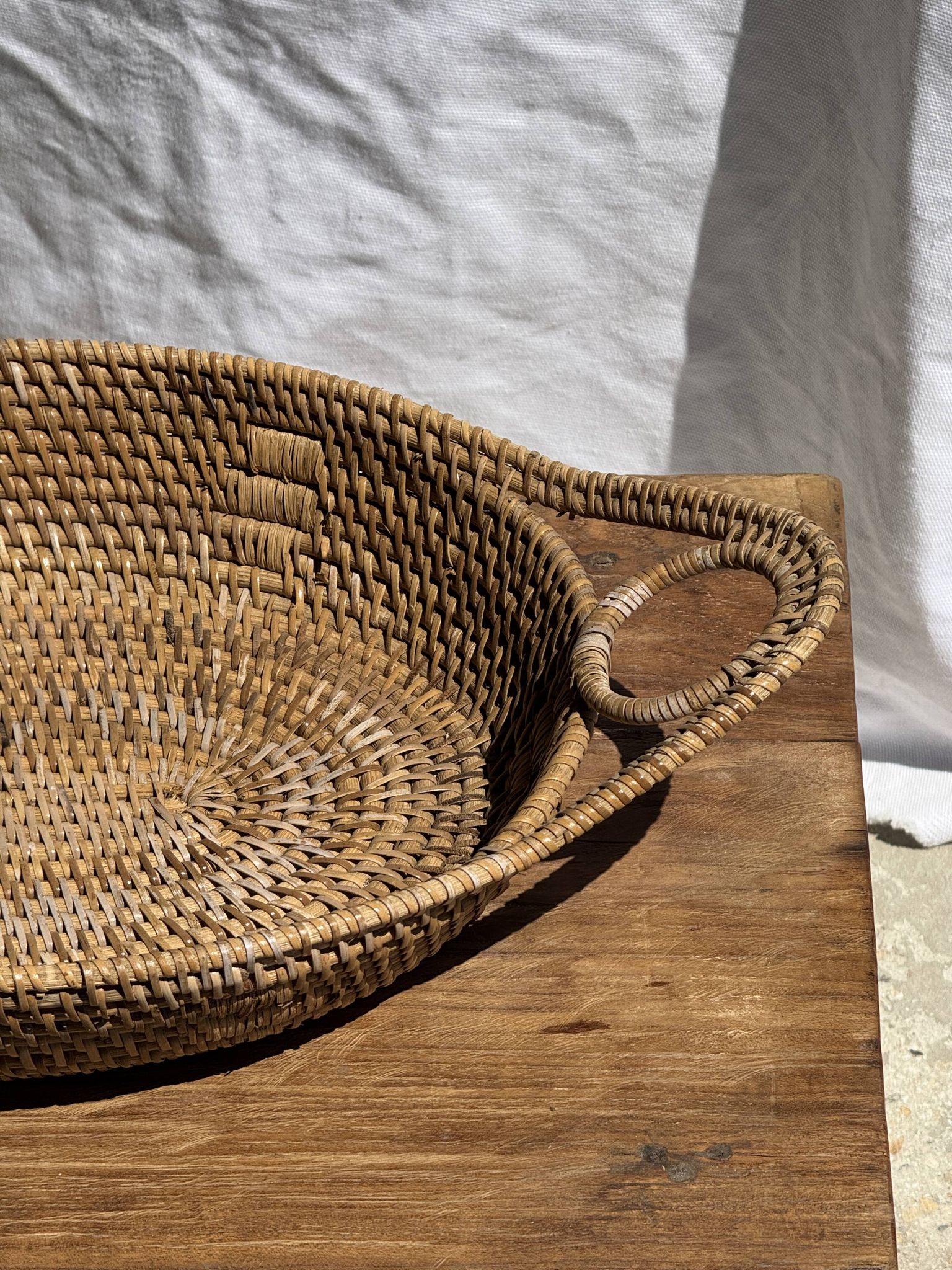 Large flat oval woven rattan basket with handles, Indonesian L53x64