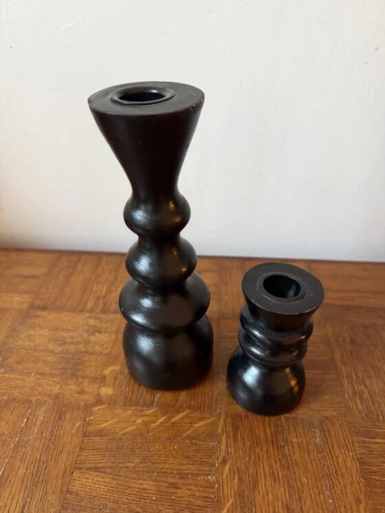 Pair of black turned wood candlesticks