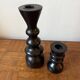 Pair of black turned wood candlesticks