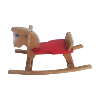 Rocking horse of the 70's in light wood