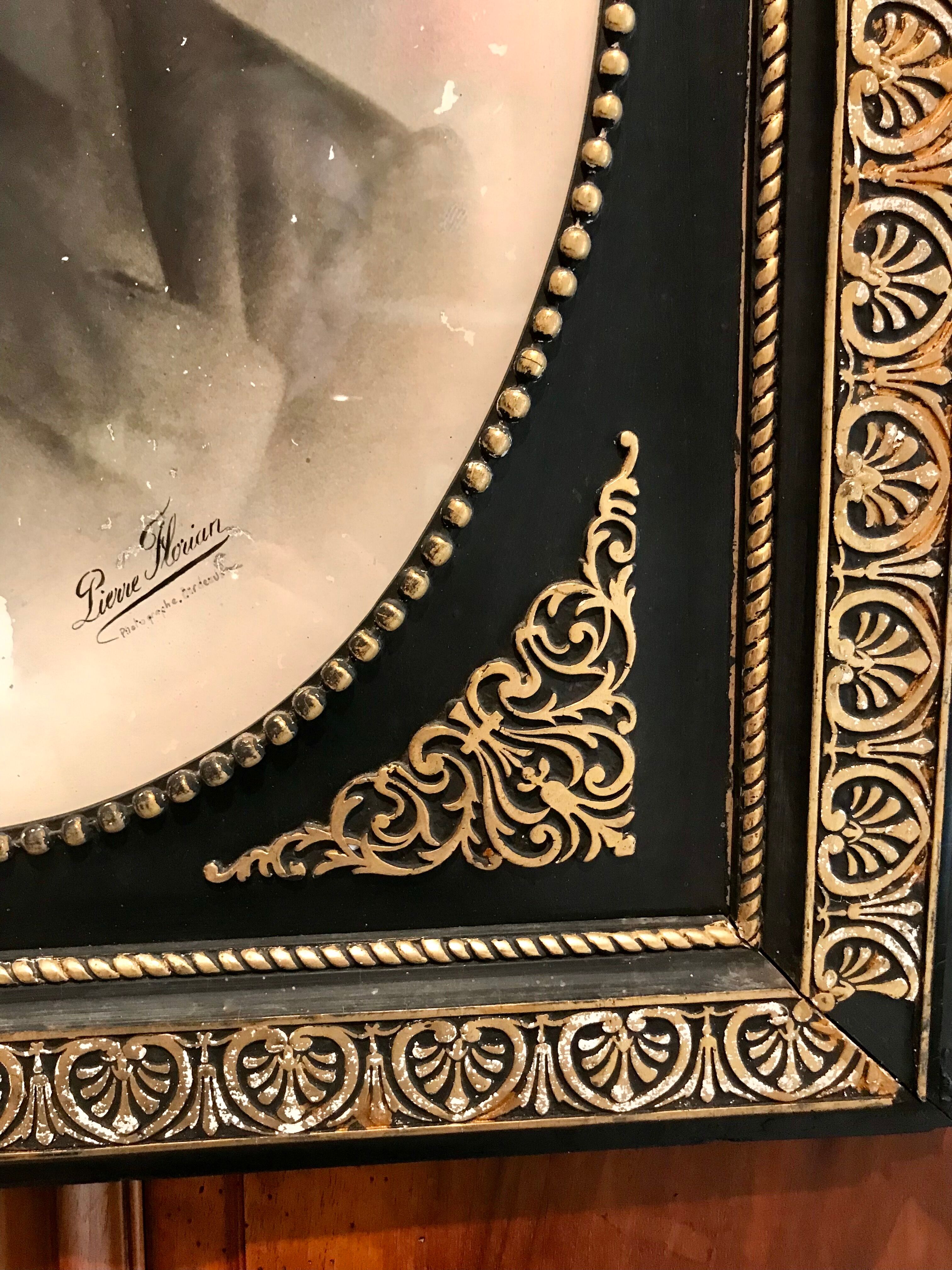 Black and gilded ebonite frame, wood and plaster 19th century