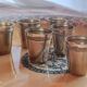6 silver-plated metal glasses, decorated with a chased ribbon design