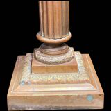 Bronze candle holder with floral motifs.