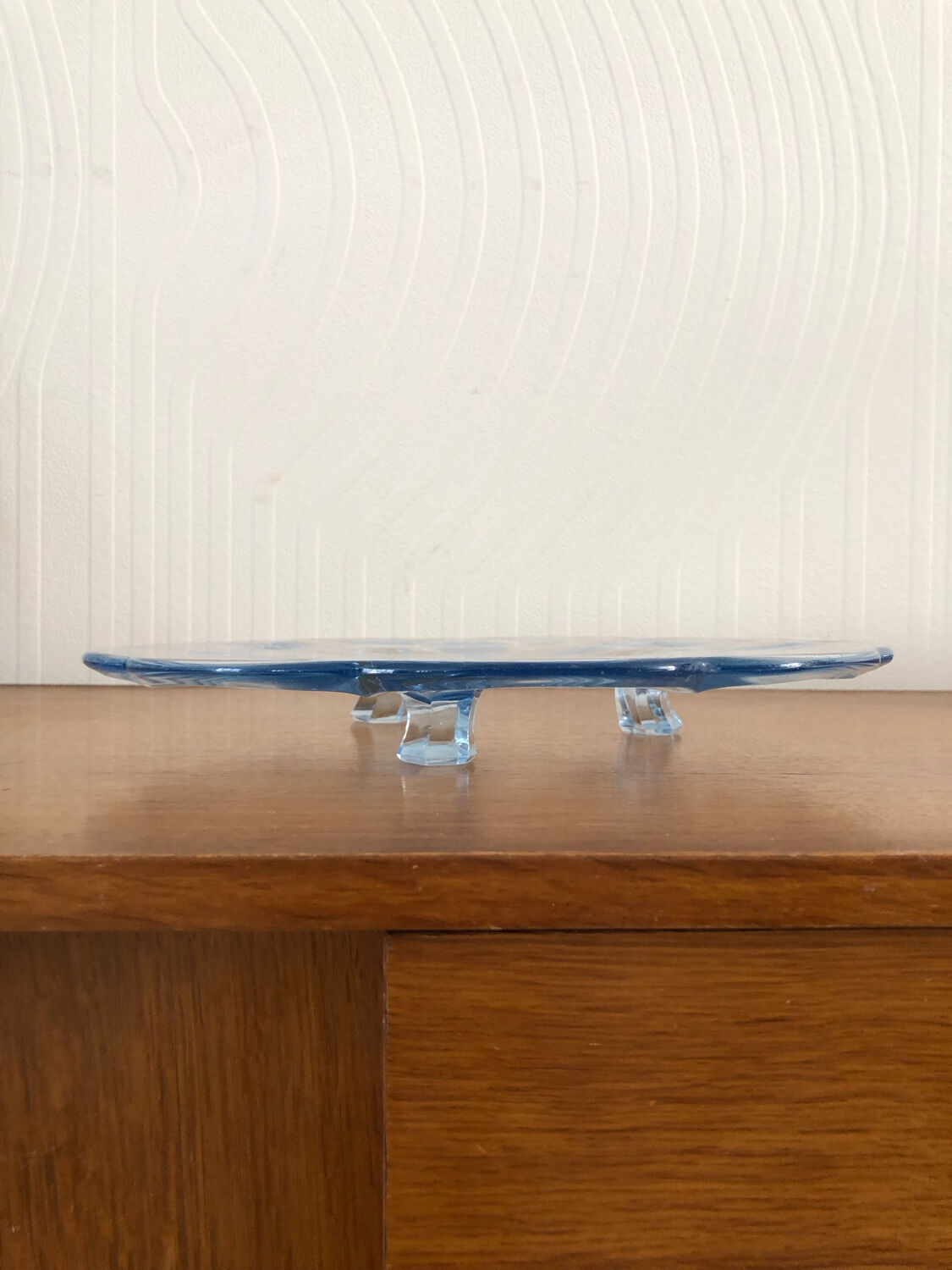Blue transparent glass pie dish on vintage stand