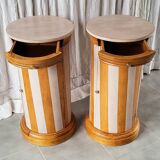 A pair of distressed bedside tables.