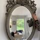 Miroir ovale biseaute  en bois et stuc