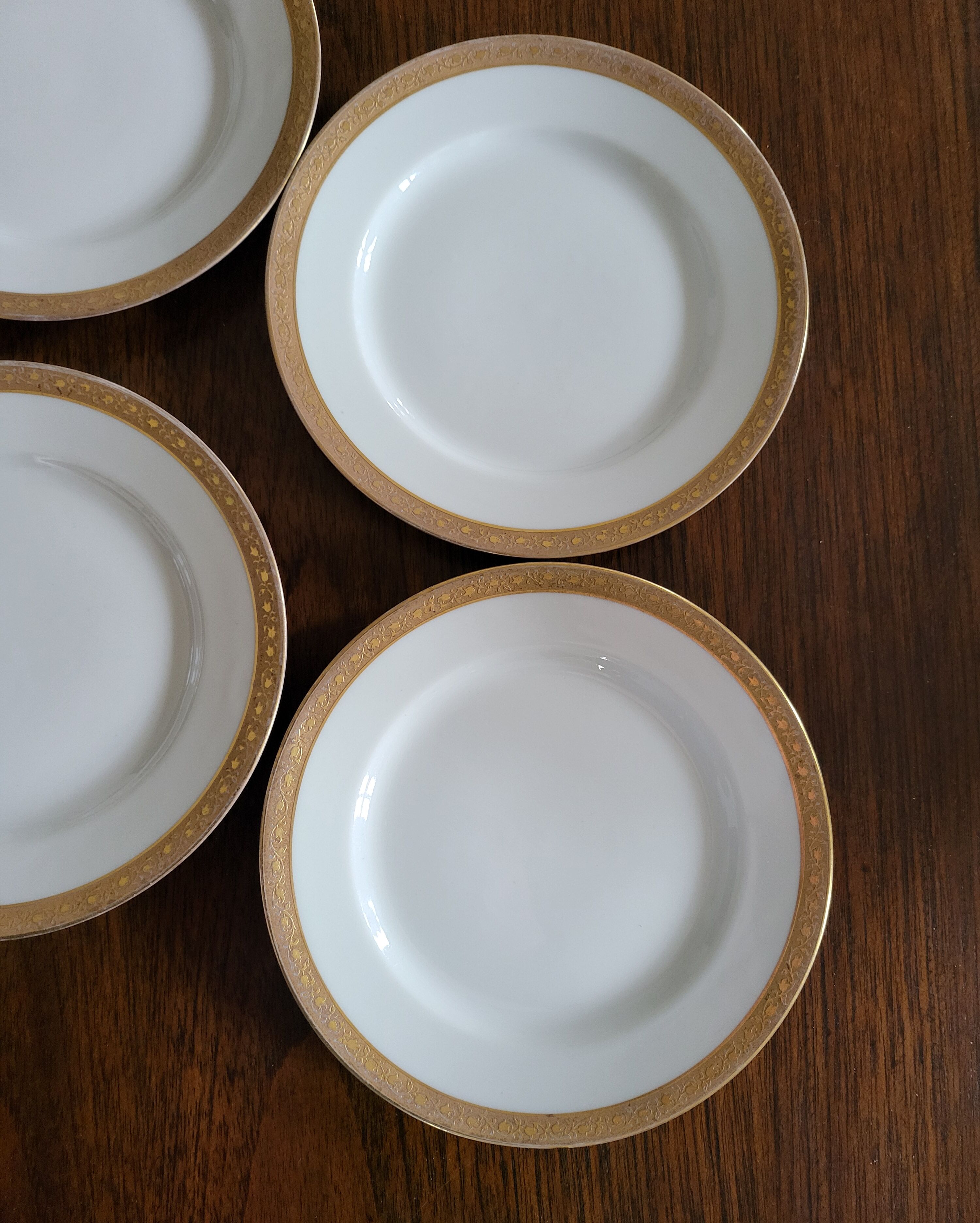 Lot of 8 small porcelain bread plates.