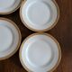 Lot of 8 small porcelain bread plates.
