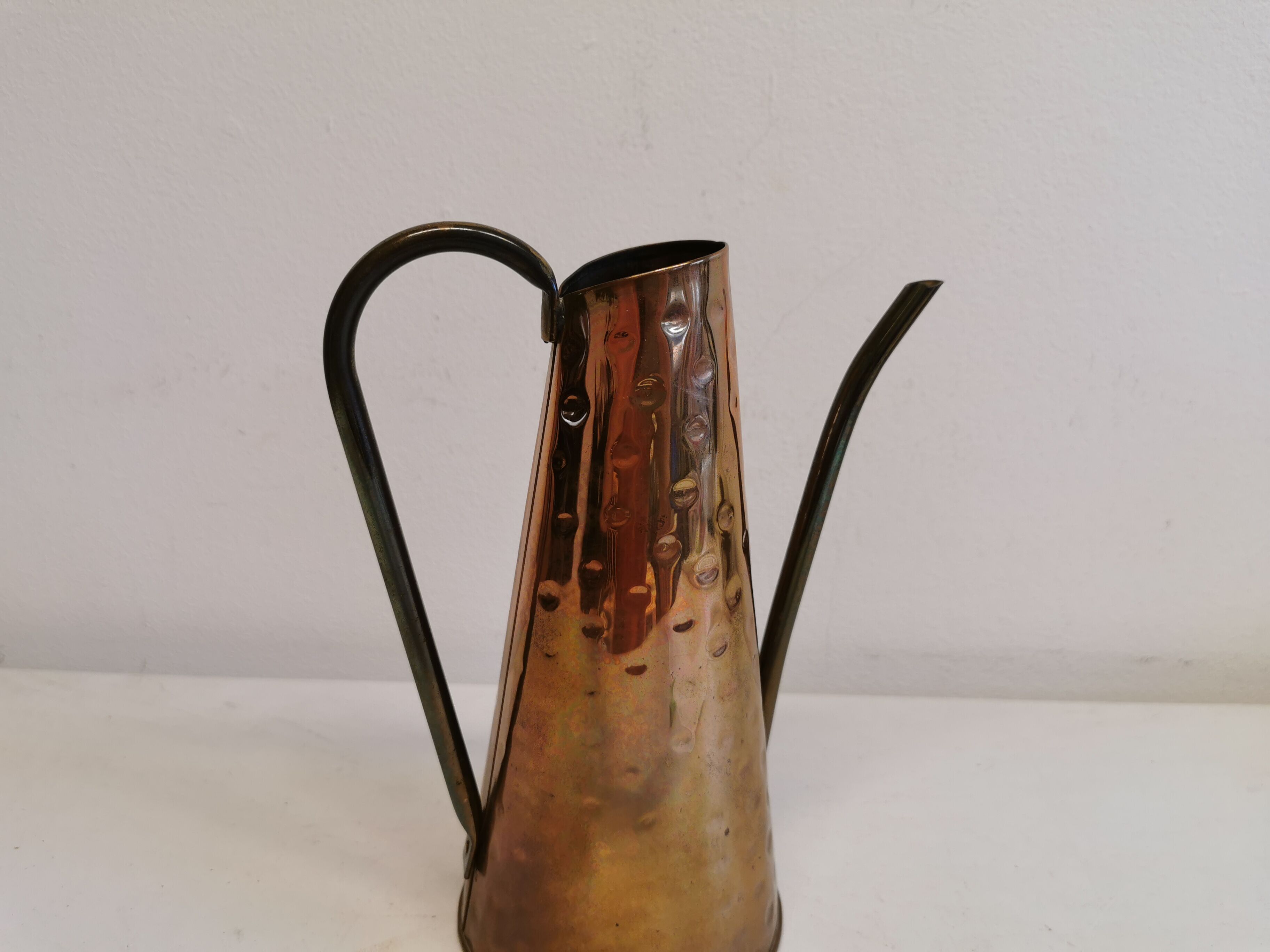 Watering can from the 1950s, made of hammered copper and brass
