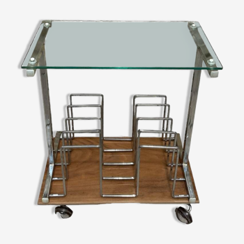 Glass and metal magazine table on casters