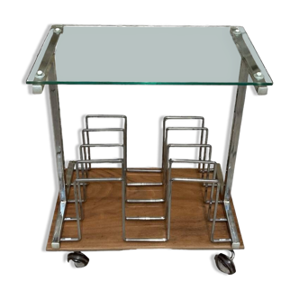 Glass and metal magazine table on casters