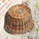 Old round wicker linen basket, dark rattan