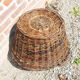 Old round wicker linen basket, dark rattan