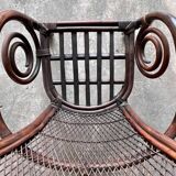 Mid-century Manou dark brown bamboo armchair with open rattan backrest, 1960s French