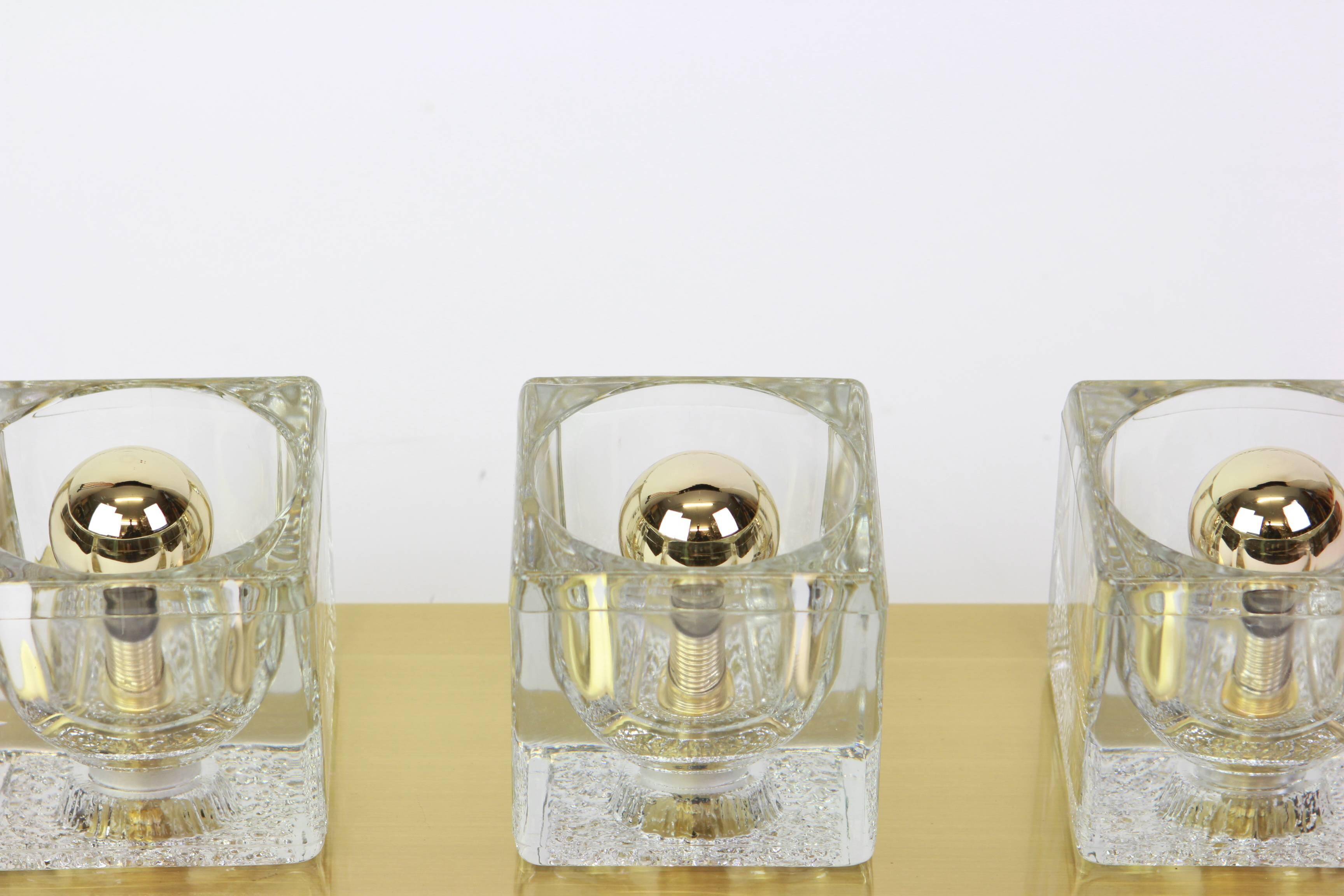 Exclusive wall sconces in crystal and brass by Peill & Putzler, Germany.