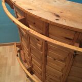 Vintage bar counter with natural wood stools