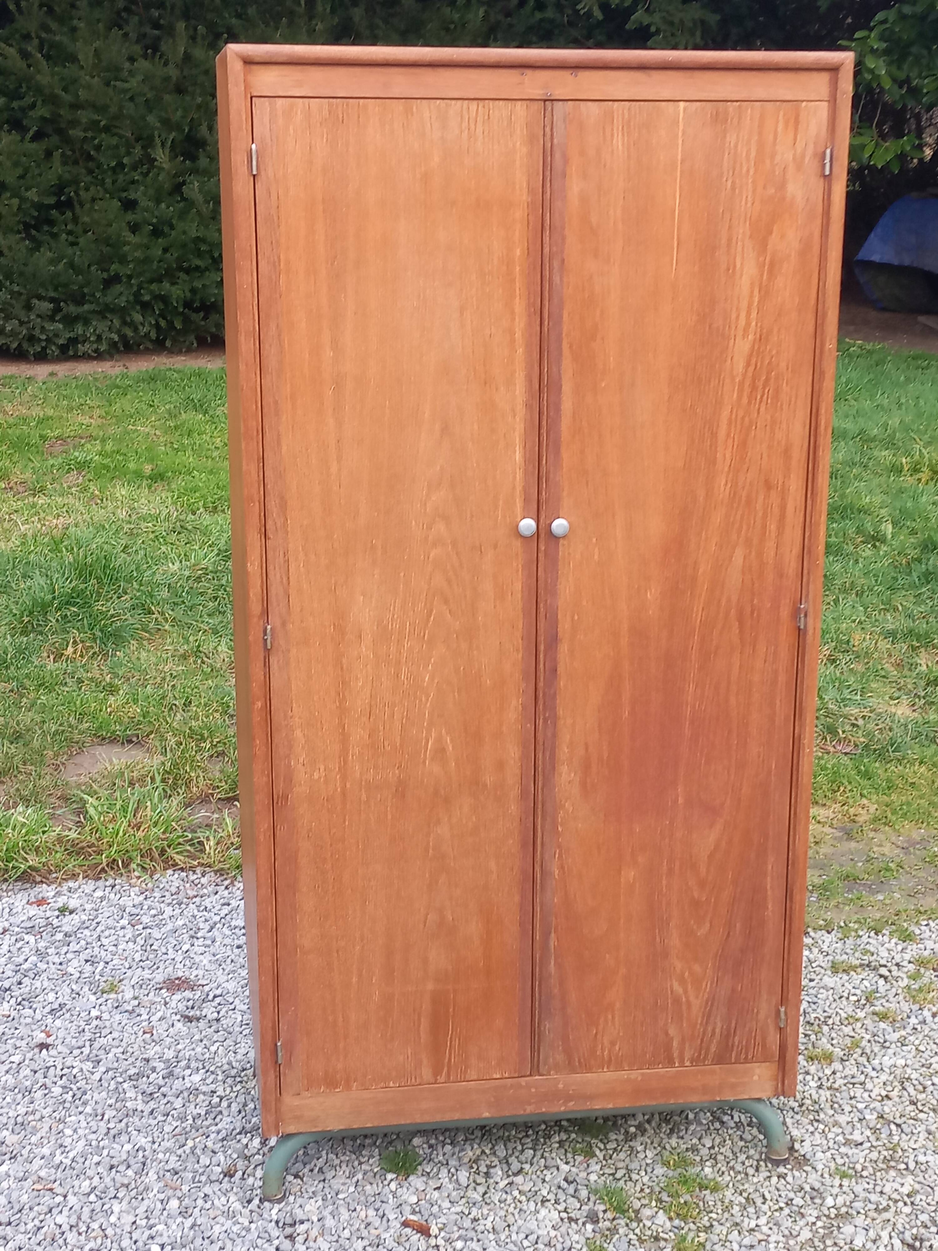 Vintage oak wardrobe with metal legs from the 1950s.